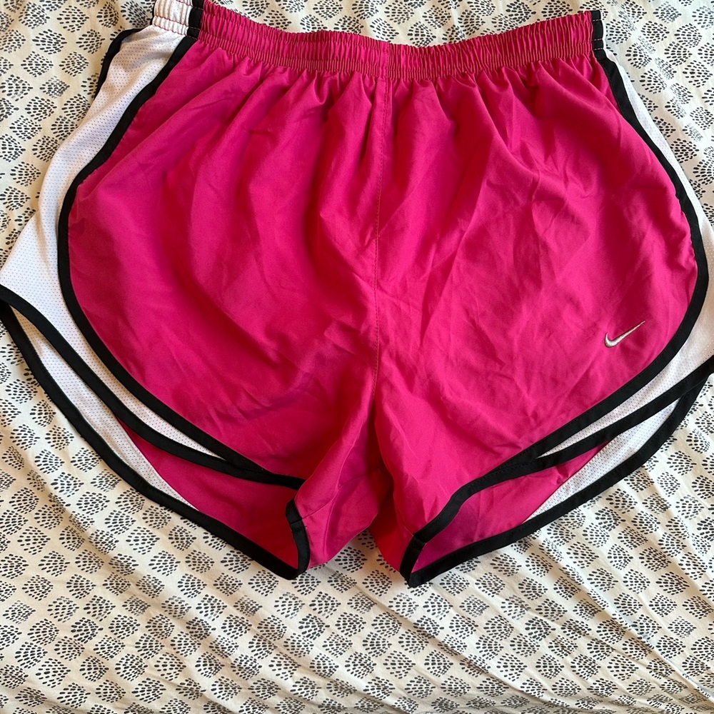 Pink Nike shorts, woman’s medium